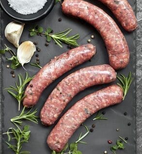 A bunch of sausages sitting on top of a table.